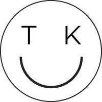 A simple black smiley face outlined in a circle on a white background.